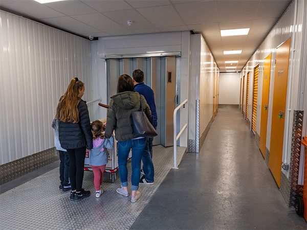 Family going in the storage unit - Self Storage units in Warrington area